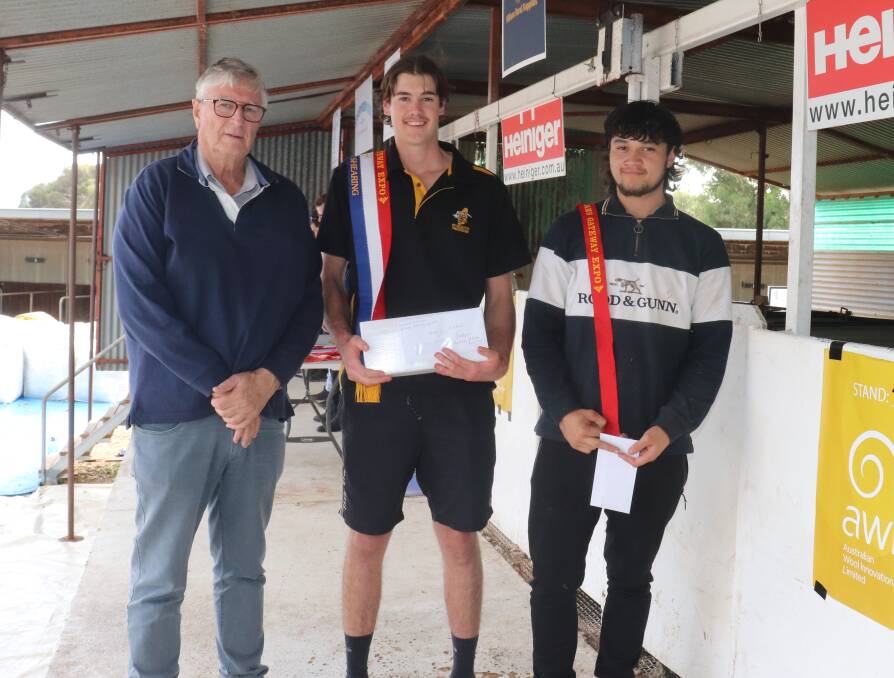 Mr Webster (left), congratulates the under 21 class winners George Burt, Calingiri and runner up Jadas Guelfi, Gisborne, New Zealand.