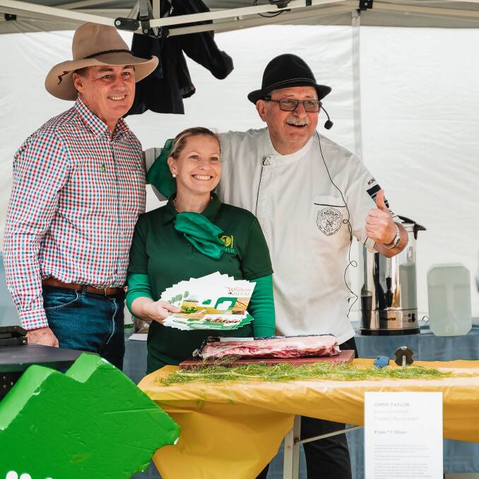 Shane (left) and Nicola Kelliher at a Farmer on Your Plate event in Perth, with celebrated butcher and farming advocate Vince Garreffa, as he cooks up some fresh cuts of meat off the Kelliher farm. Ms Kelliher is chairwoman of Farming Champions, which organises the event each year. It is a chance for local producers to connect with visitors who otherwise wouldnt have a connection to agriculture.