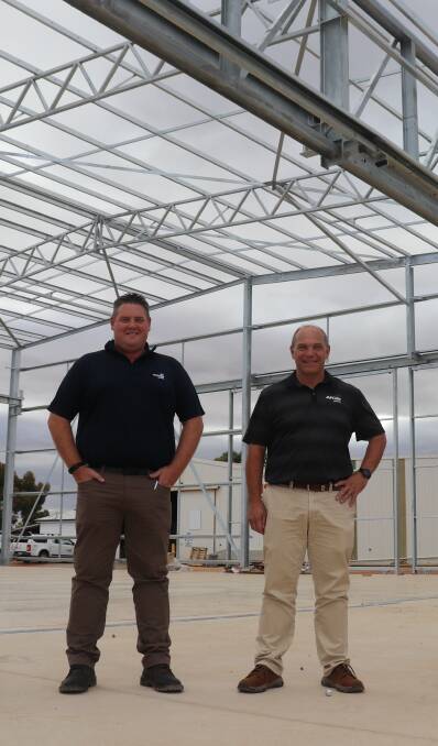 AFGRI Wongan Hills branch manager Brendan Barratt (left) and new AFGRI Equipment Australia chief executive officer Wessel Oosthuizen in the new service centre being constructed at the Wongan Hills branch. Picture by Mal Gill.