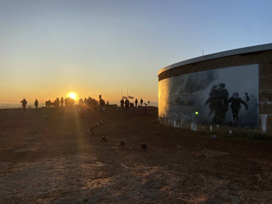A big crowd was on hand for the Kondinin Anzac Day service to watch the sun rise over the new mural.