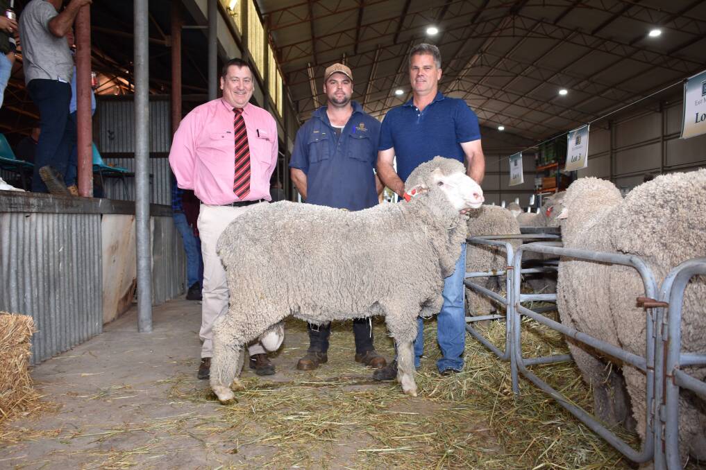 With the $5400 top-priced ram at last weeks East Mundalla on-property ram sale at Tarin Rock, purchased by the Taylor family, Kukerin, were Elders stud stock manager Tim Spicer (left), buyer Ryan Taylor and East Mundalla co-principal Ross Robinson.
