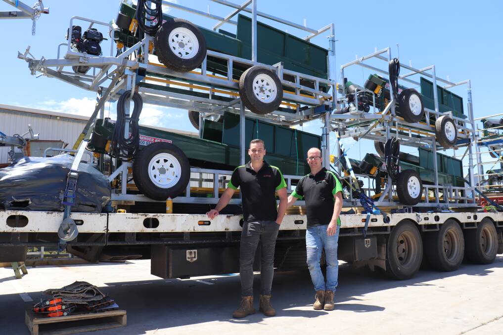 Sales manager Martin Buggins (left) and director David Jackson with the truck which hauled 12 Commander Ag-Quip V-Express Sheep Handlers across the country.