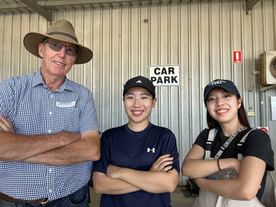 Stable fly action group chairman Bob Wilson, with two Japanese entomology students.