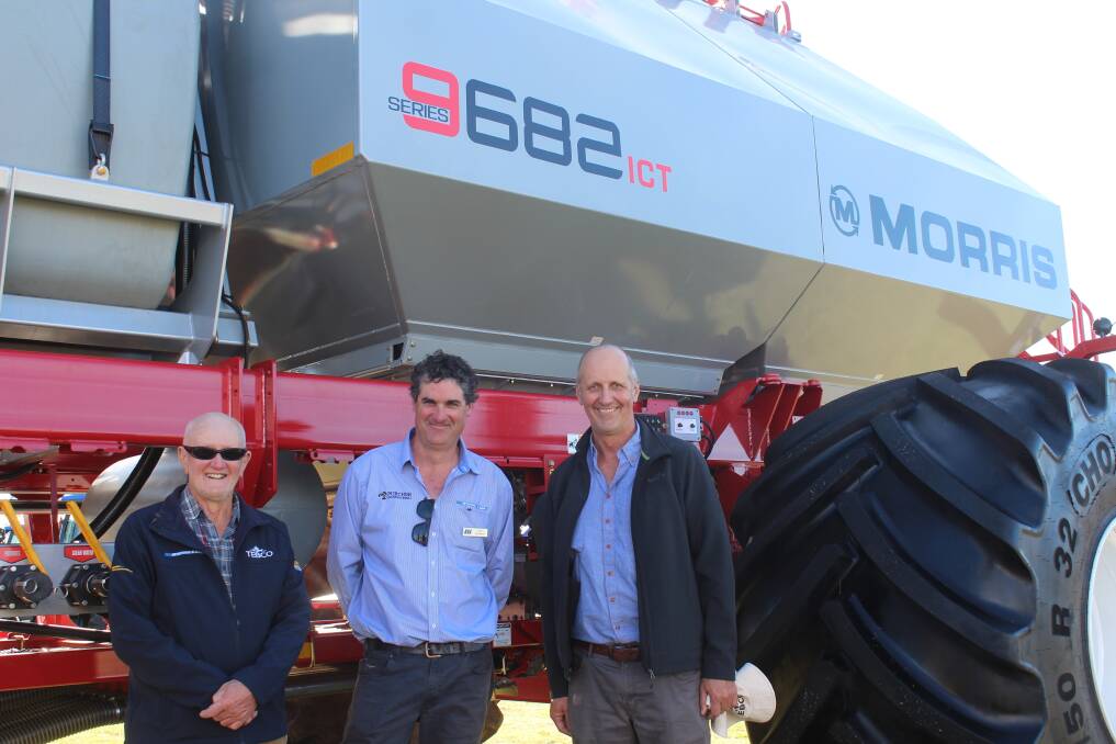 Josh McBeath (centre), McIntosh & Son, Geraldton, with Terry (left) and Jeff Cockman, Allanooka, and a Morris 9682 air cart with input control technology (ICT) for section control. The family is looking forward to receiving a similar air cart for seeding next year that will be hitched to their Morris C3 Contour Drill.