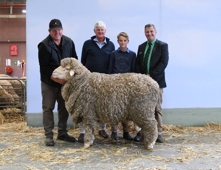 This Poll Merino ram from the Rangeview stud, Darkan, sold for $10,000 to the Borambil stud, Corowa, New South Wales. With the ram were Rangeview principal Jeremy King (left), buyer Roger Mathews and his son Ollie and Nutrien Ag Solutions NSW stud stock representative Rick Power.
