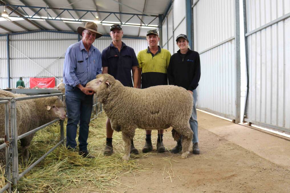 Corey and Scott Flavel (centre), Dowerin, were extremely happy to buy the ram in pen one at the Ejanding on-property ram sale for $2400, and are with the ram along with stud principal Brett Jones (left) and his daughter Shanae.
