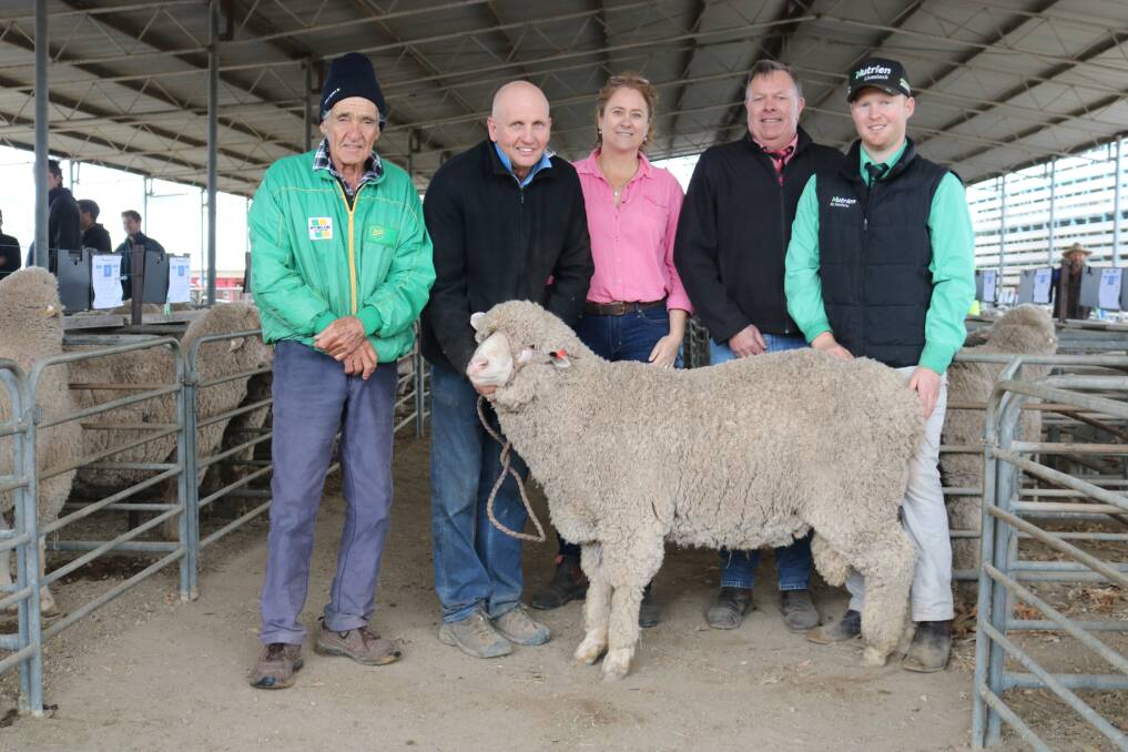 With the $3100 top- priced Poll Merino were buyer Ned Whybrow (left), Badgingarra, Arra-dale stud co-principal Ashley Sutherland, Alli Whybrow, Elders auctioneer Graeme Curry and Nutrien Livestock auctioneer Dan Major.