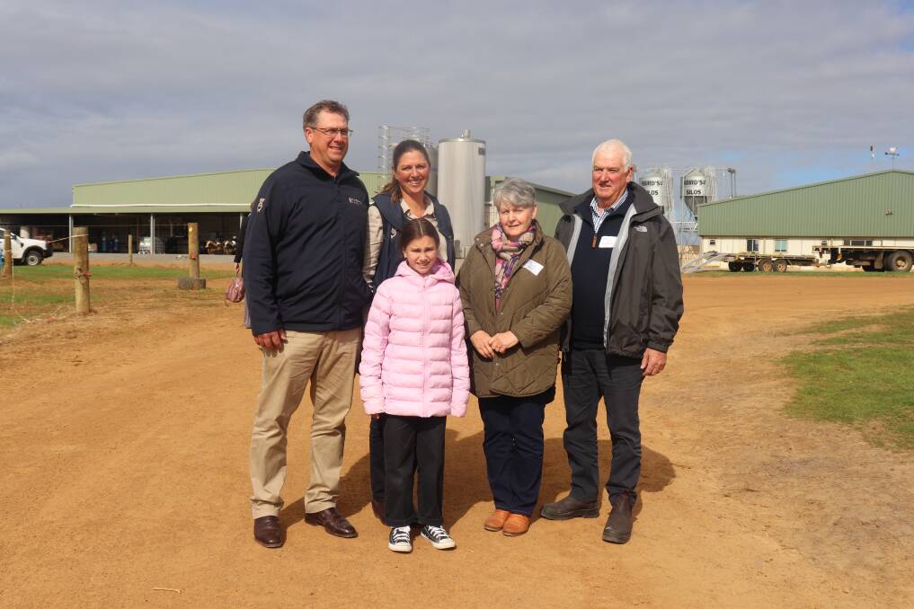 Ken (left) and Bonnie Ravenhill, Ravenhill Pastoral, Narrikup, with their daughter Lola, 9, and Kens parents Jan and Graham in front of the only 100 stand rotary dairy in Western Australia (back left), and the 60 stand rotary dairy it replaced (back right) at Dairy Innovation Day 2023.