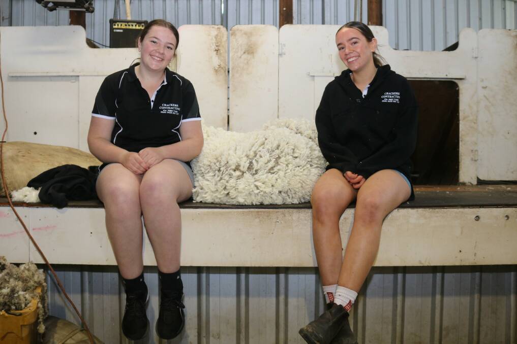 Sisters Matilda (left) and Darcy King spend every school holidays helping out in the shearing shed.