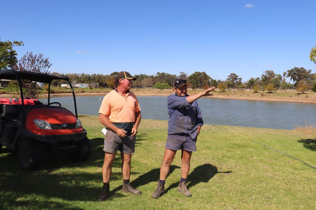 Mario Tosana (right), Boyanup, explains to Steve Slater, Balingup, how he built up a natural environment for waterbirds at his farm, which has created another food source for foxes in the area.