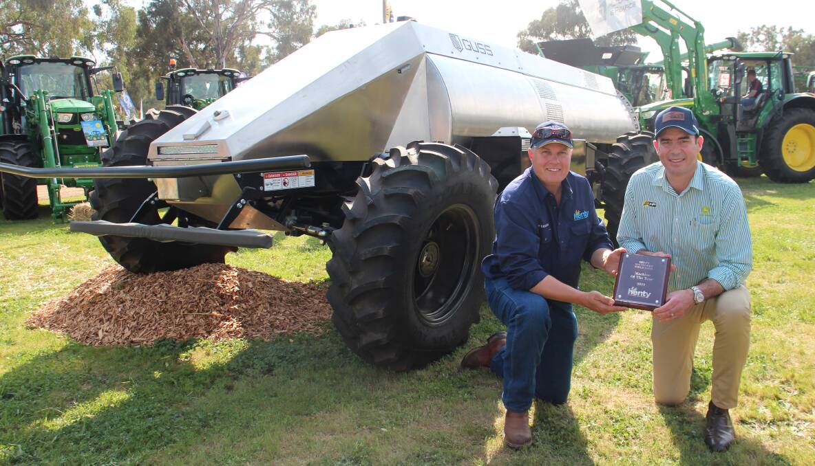 Judge Warren Scheetz and Hutcheon and Pearce managing director Arron Hutcheon, with the GUSS automated sprayer awarded machine of the year at Henty Machinery Field Days. Photo by Alexandra Bernard.