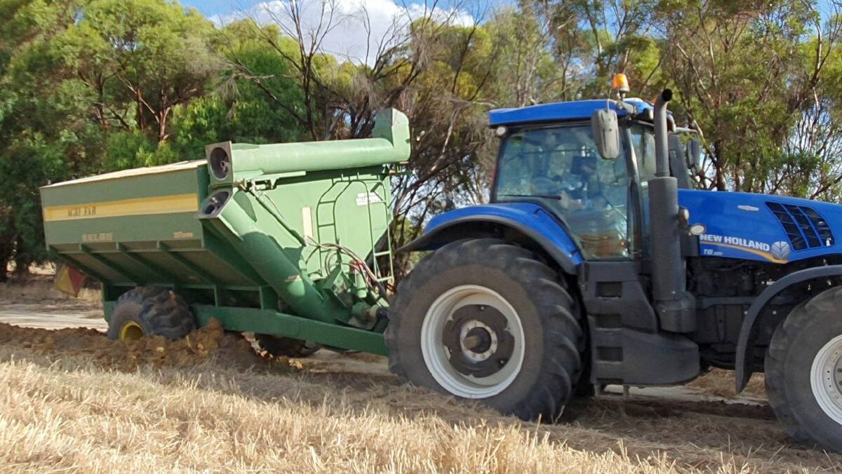 A bogged tractor and chaser bin onfarm after lots of rain waterlogging, bogged equipment, rain delays have all contributed to a delayed harvest in many parts of Australian this year and contributed to increased stress and potential mental health issues for farming families.