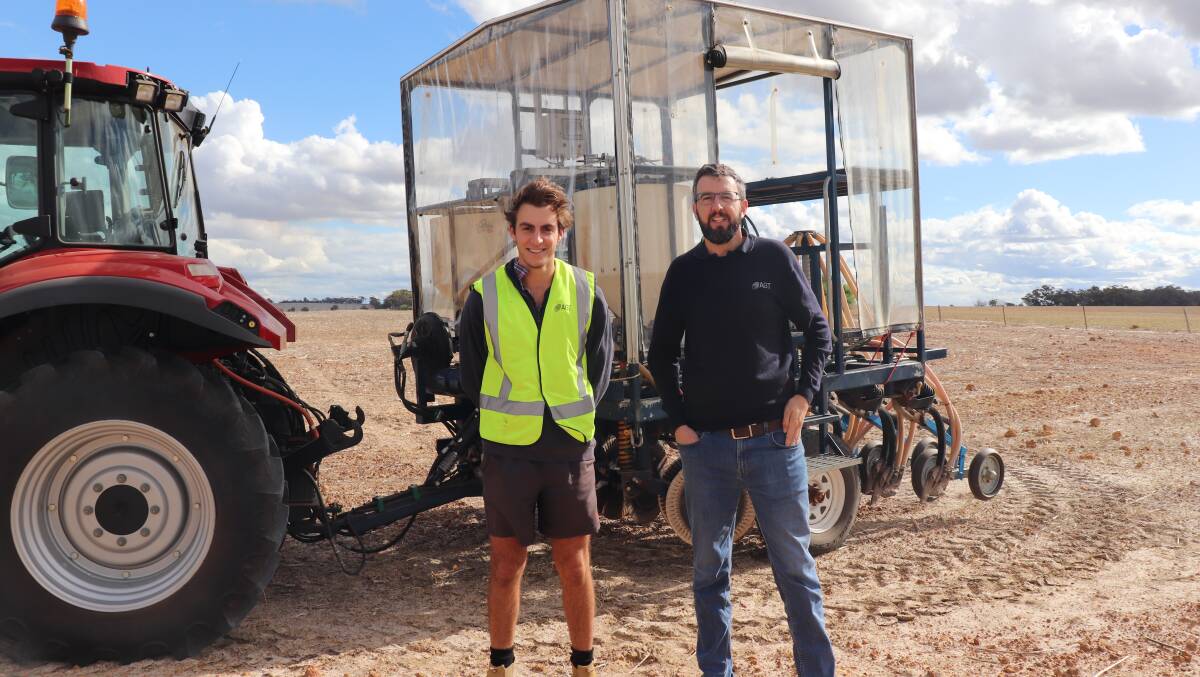 Daniel Nazzari (left), with AGT wheat breeder Dion Bennett, during his work experience. The photo was taken in front of an AGT trial seeder.
