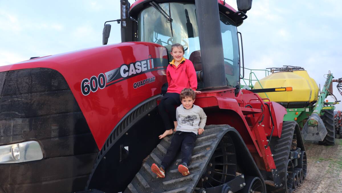  Hannah Bone (left), 6, with brother Liam on top of the tractor tracks.