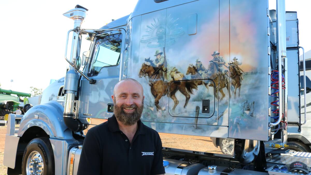 Truck Centre, Forrestfield branch customer manager Clayton Cowling with Darren and Carmen Bairstows new Mack truck, complete with mural.