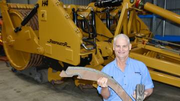Rocks Gone's Tim Pannell with the ripper boot and leading edge replacement parts used by the company's H4 Reefinator, which also now features automation technology, easing demands on operators and improving machine and tractor performance. Picture supplied