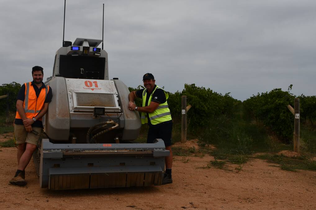 Smart Machine's Angus Cochrane and Duxton's Wayne Ellis with the OXIN autonomous tractor, which is being trialled in Duxton's Euston vineyard in NSW. Picture Paula Thompson