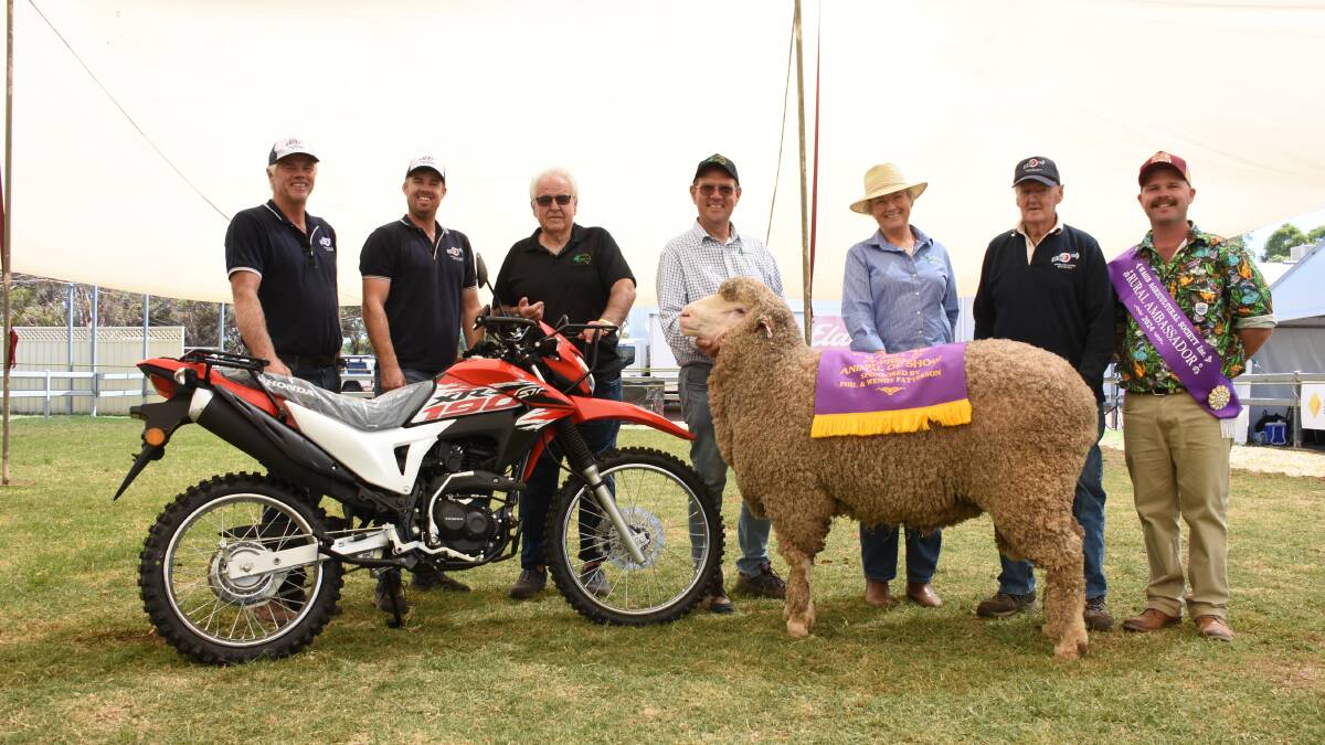 The supreme animal exhibit of this year's Wagin Woolorama was this Poll Merino ram from the Ledwith family's Kolindale stud, Dudinin. With the winning exhibit and the new Honda two-wheel motorbike prize provided by competition sponsor 4Farmers were Kolindale principals Mathew (left) and Luke Ledwith, 4Farmers director Phil Patterson, 4Farmers general manager Bill Crabtree and 4Farmers sales and adminstration representative Cathy McKenna, Kolindale's Arthur Major and Wagin Woolorama Rural Ambassador Jack Stallard.
