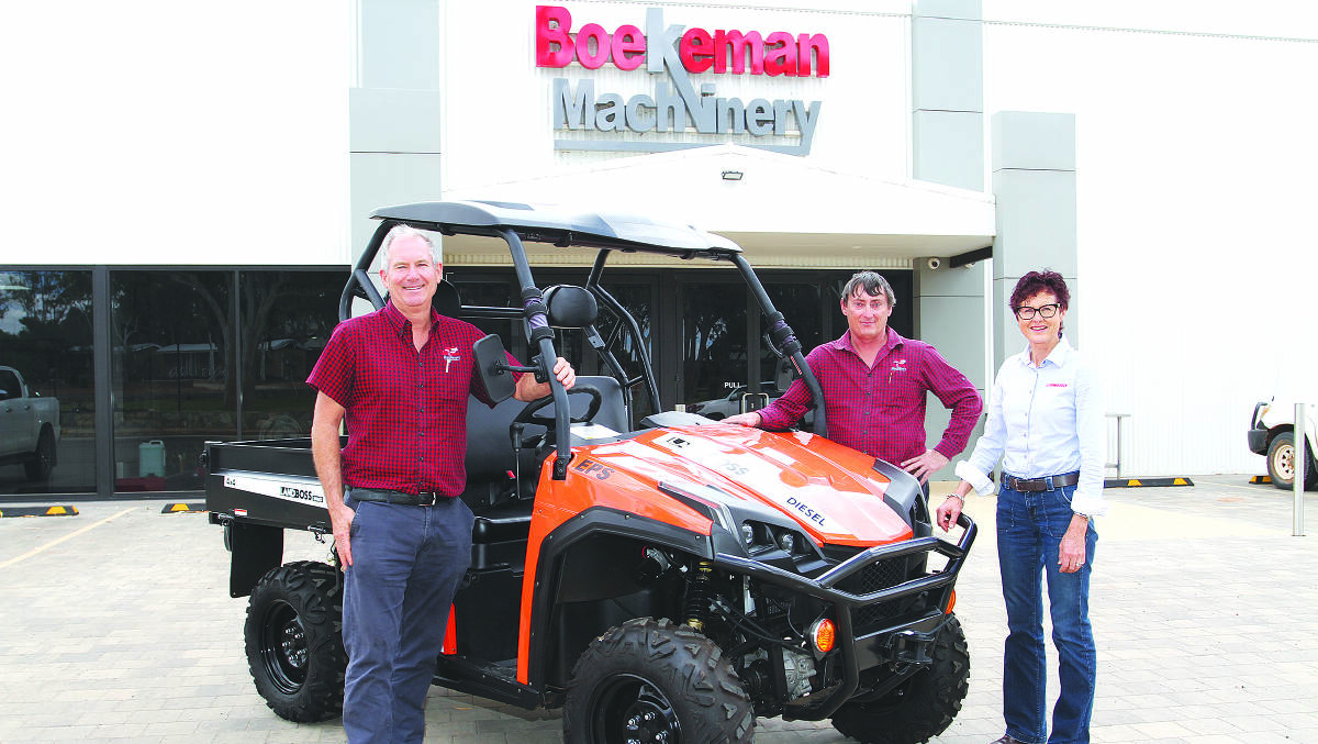 Boekeman Machinery dealer principal Stuart Boekeman (left) and Dowerin branch manager Peter Crippen, with Farm Weekly business development and sales manager Wendy Gould and a LANDBOSS 800D side-by-side vehicle, part of this years annual Angus heifer competition prize. Vehicle for illustration purposes only.
