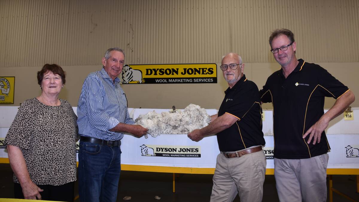 Mumballup superfine woolgrowers Faye and Jim Pepper visited the Dyson Jones wool stores last week to view their line of wool which sold for the seasons top price to date of 4380c/kg clean in sale 23 on December 6. Looking over the line was Dyson Jones wool marketing specialist Tim Chapman (second right) and Dyson Jones WA manager Peter Howie.