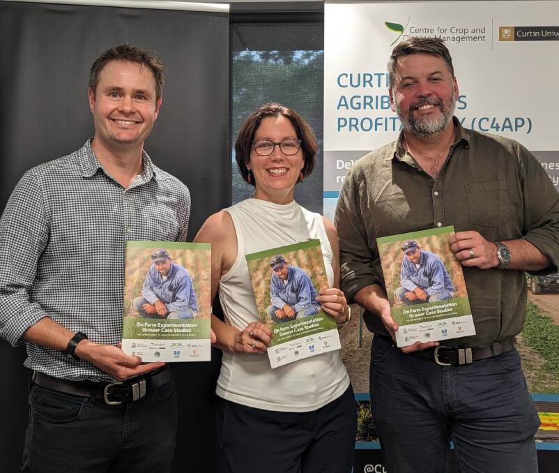 Chief executive of Food Agility CRC Dr Mick Schaefer (left), CCDM researcher and project leader Dr Julia Easton and NGIS general manager Matt Stewart, holding copies of the recently released On Farm Experimentation Grower Case Studies at a recent Food Agility CRC event.