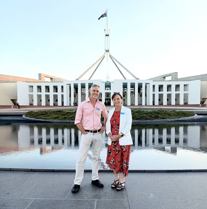 Southern Rangelands Pastoral Alliance board members Fiachra Kearney and Debbie Dowden in front of Parliament House, Canberra, as part of a series of meetings in the national capital.