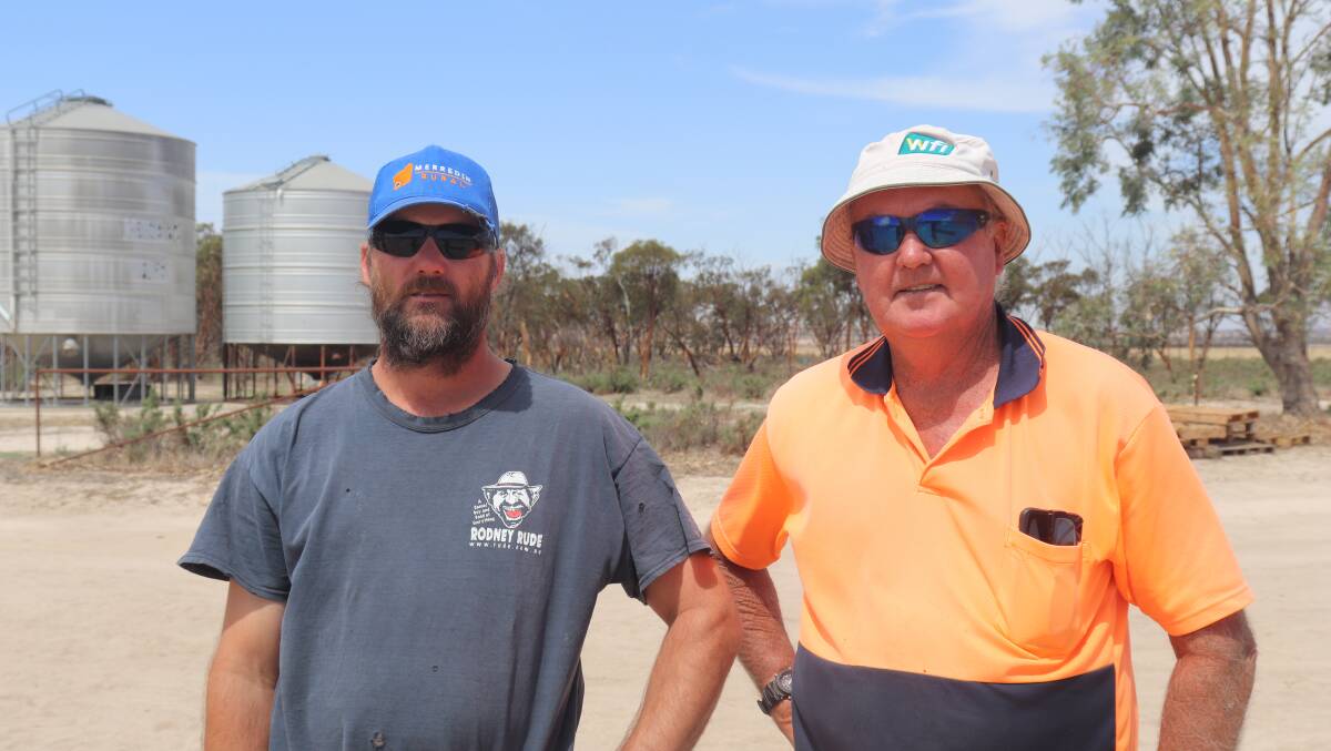 Vendors Ben Heinrich (left) with his father Kevin, at the clearance sale at their North Baandee property. A 2016 Case 4430 Patriot self propelled boomsprayer, with a 6200 litre tank and 3788 hours on the engine, turned out to be the big ticket item sold, when it was bought by KS & N Argent for $285,000.