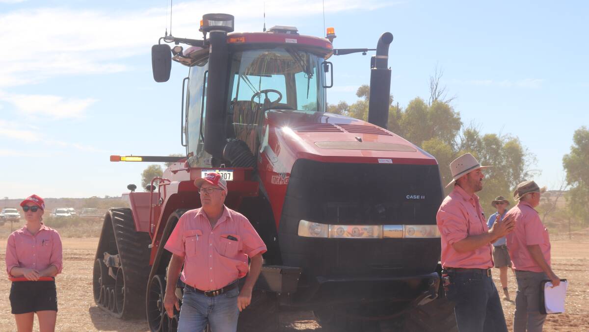 Elders auctioneer Graeme Curry (second left) with Steele Hathway calling out bids for the 2019 Case IH Quadtrac, which sold for $540,000.