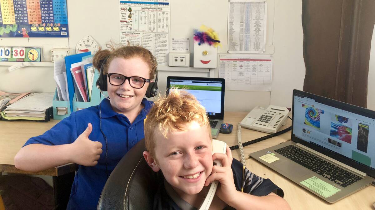 THUMBS UP: The Isolated Children's Parents' Association has thrown its support behind Skymuster Plus. Pictured are students Shayla and Riley McDonald from Thorntonia Station, Camooweal, Qld. Photo: ICPA