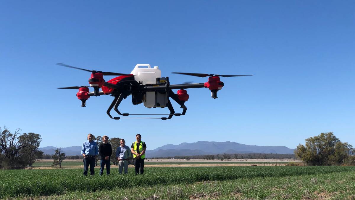 FLYING HIGH: University of Sydney PBI director for northern agriculture Guy Roth, precision weed control scientist Guy Coleman, director of weed research Michael Walsh and XAg Charles Chow demonstrating the spray drone.
