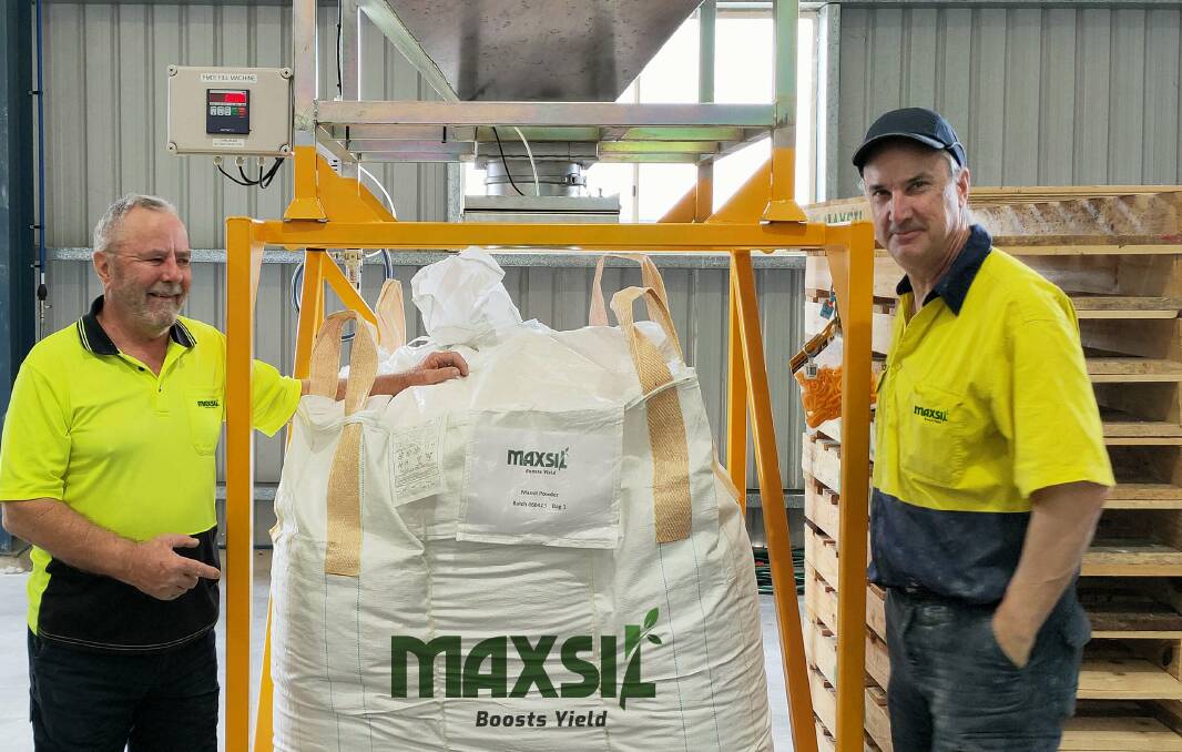 MaxSil managing director, David Archer, and plant supervisor, Michael Trutwin, at the compnay's Brendale factory with the first one tonne bag of glass-based silicon fertiliser for commercial distribution. Photo supplied.