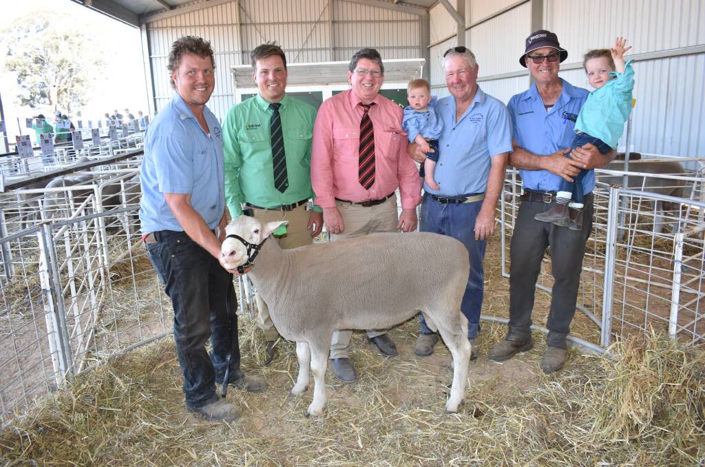 The two White Suffolk stud sires offered both made $3000 and were sold to Tim Stevenson, Jolma stud, Cunderdin. With one of the rams is Stockdale co-principal Brenton Fairclough (left), Nutrien Livestock York, Beverley and Quairading agent Denis Warnick, Elders stud stock prime lamb specialist Michael O'Neill, Stockdale co-principal Laurie Fairclough with grandson (Brenton's son) Harry Fairclough, eight months, and Westcoast Wool & Livestock, York and surrounds agent Mark Fairclough with Brenton's daughter Piper Fairclough, 2.