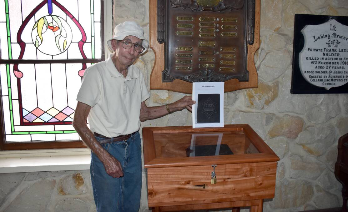 Mr Bell shows the new permanent home for the Holland family bible inside the villages stone chapel.