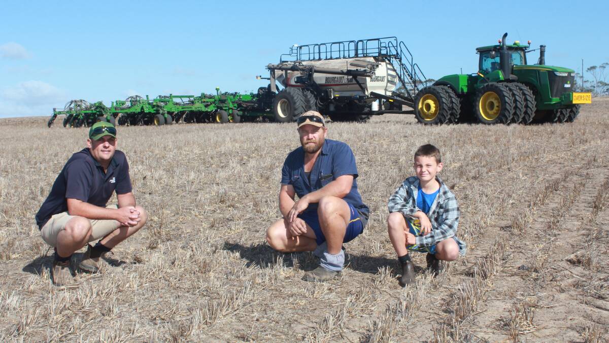 AFGRI Equipment Gnowangerup sales representative Mat Chambers (left), with O'Keeffe farm overseer Chad Humphries and his son Jack, who took some time off his last day of school when he heard Farm Weekly was visiting.