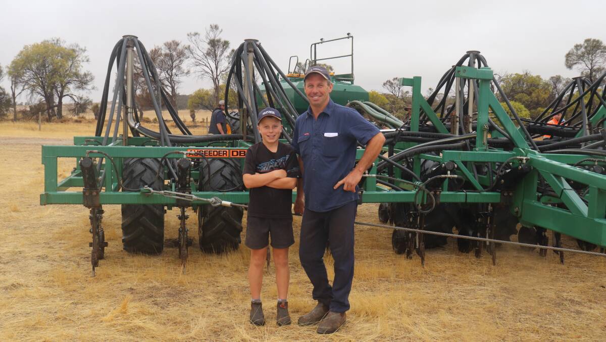 George (left) and Daryl Kilpatrick, Nomans Lake, looked over this Ausplow DBS D260 10.9 metre precision seeder before the sale. It sold later for the sale top price of $86,000.