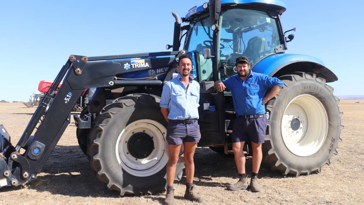 Top item of the East Brookton clearing sale was this 2018 New Holland T7.200 front-wheel-assist tractor with 1635 hours showing and fitted with a quick-release Trima front end loader. It was initially passed in at $119,000 but sold privately immediately afterwards for the reserve price of $125,000 to Stockdale Pastoral Co, Busselton. Pictured are Stockdale representatives Jack Day (left) and Hartley Bell.