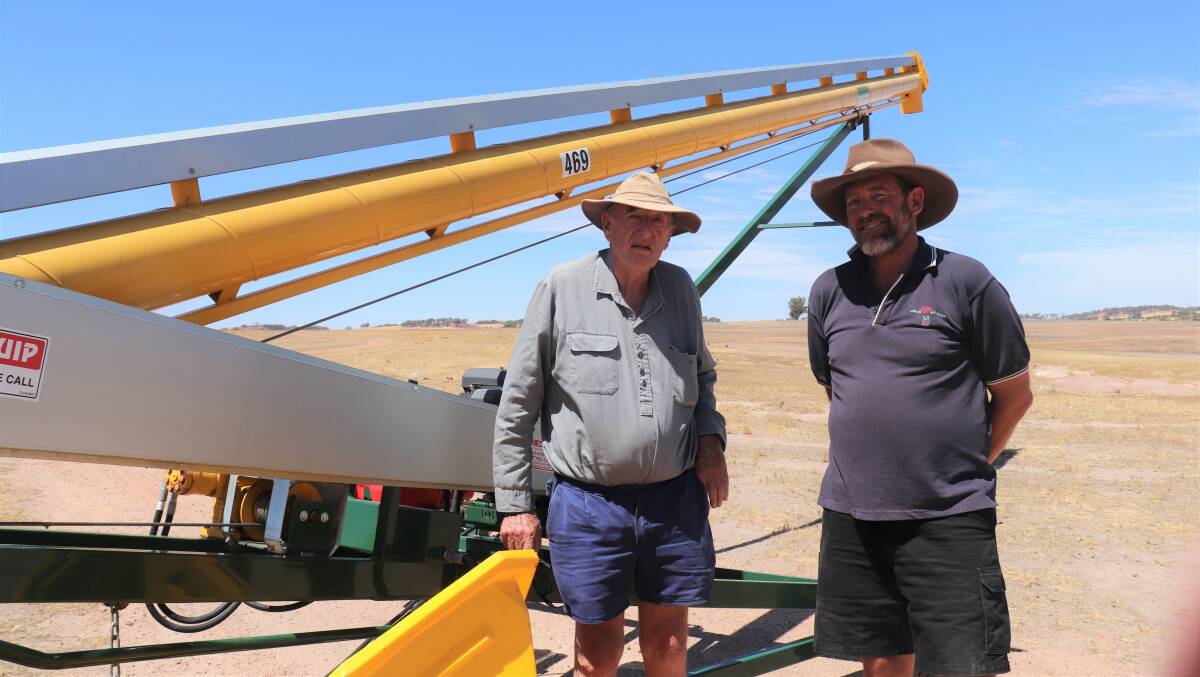 Father and son, John (left) and Alan Price, Pingelly, with the as-new condition self-propelled Commander Ag-Quip 469 grain auger with 17 kiloWatt Kohler motor which sold for $27,500.