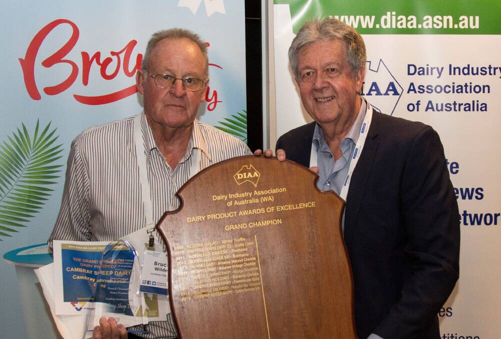 Bruce Wilde (left), founder with his wife Jane of Cambray Cheese, Cardinup, receives the 2019 Dairy Industry Association of Australia's WA Grand Champion Dairy Product award for Farmhouse Gold mature sheep-milk cheese from Colin Webb, representing award sponsor Viscount Plastics Pty Ltd.