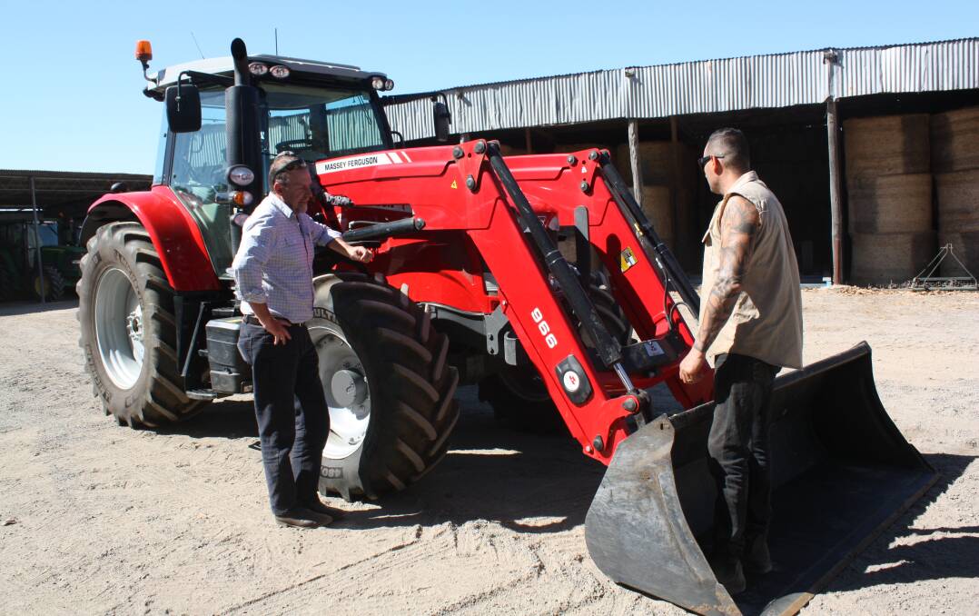 Bunbury Machinery branch manager Darren Pulford (left) talks with Harvey dairy and beef producer Jason Parravicini about the performance of his Massey Ferguson 7614 tractor.