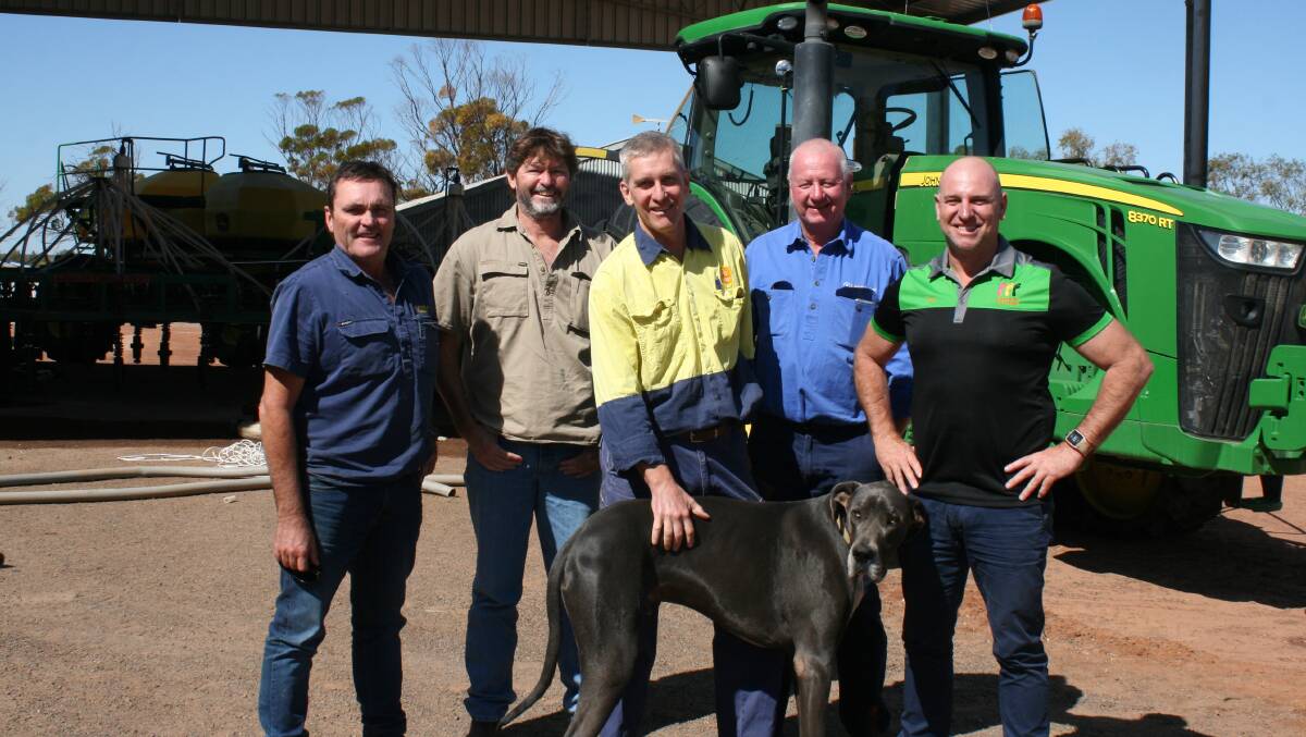 Tammin farmer and Carbon Ag Solutions ambassador Brad Jones (left) with MEAG Soil Consultancy director HF De Wet, C-WISE project manager Tim Casey, Carbon Ag Solutions director Jack Arundel and Carbon Ag Solutions chief executive officer Brad Wisewould with Bungulla Farms resident Diesel, the Great Dane.