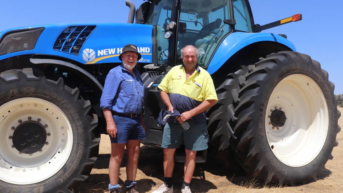 Rob Mullan (left), Wickepin, and Mark Patterson, Nyabing, with a 2013 New Holland T8.275 tractor that later was equal second top lot, selling for $165,000.