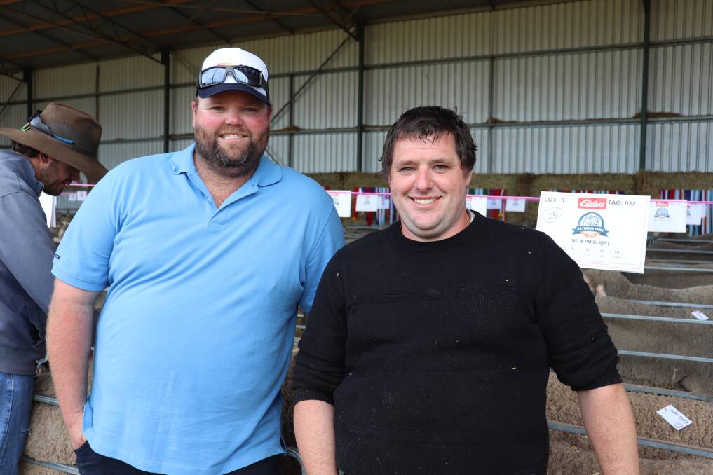 Daniel Fleay (left), Talbot Pastoral Company, Beverley and Seymour Park stud principal Clinton Blight discuss the team of 11 rams Daniel and father David purchased at the sale.