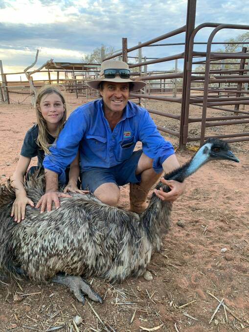 Bullara stations pet emu Emmit, with Tim Shallcross and daughter Mimi.