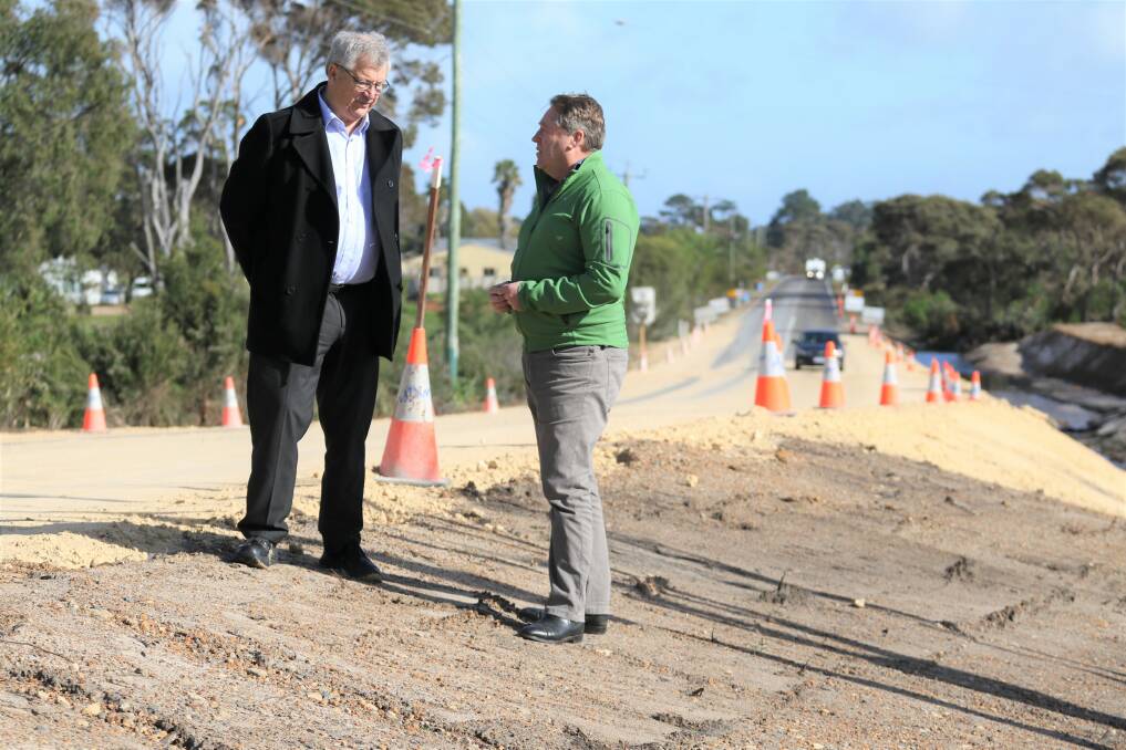 City of Albany mayor Dennis Wellington (left) and Federal MP for O'Connor Rick Wilson inspect storm damage and road repairs at Lower Denmark Road just west of the township of Cuthbert, between Albany and Denmark.