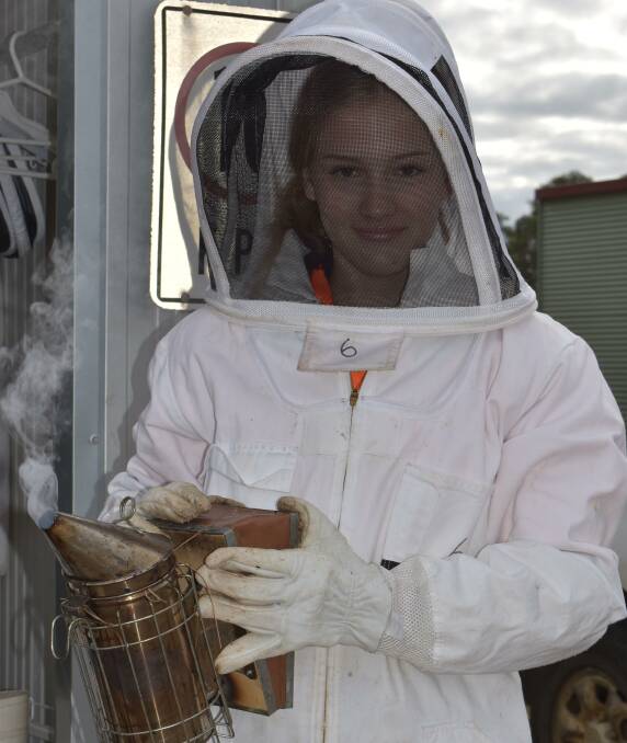 Western Australia College of Agriculture, Denmark, Year 11 student Abby Kemp in a suit with bee smoker.