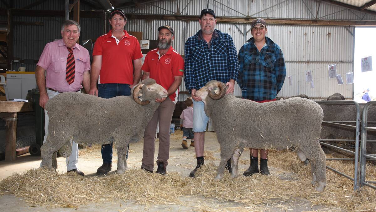 Prices hit a high of $2000 at the Canowie Fields on-property ram sale at Gairdner for these two Merino rams. With them were Elders Jerramungup branch manager David Halleen (left), buyer Noel Keding, Frankland, Canowie Fields stud principal Jason Griffiths and buyers Ian and Ryan Pope, Cranbrook.