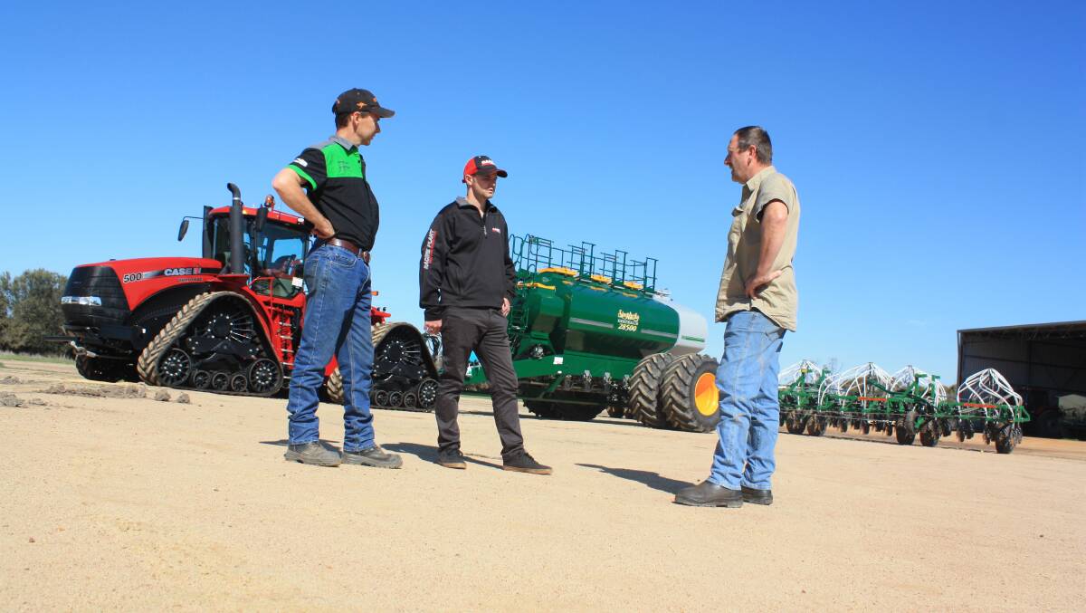 Discussing the performance of the new seeding rig before it was put in the shed last week were employee Steve Boyce (left), RedMac salesman Tim King and farm manager Dave Forrester. The rig established 5700 hectares of crop for Yerecoin farm enterprise T & S McDonald.