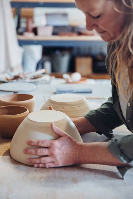 Narelle Clark in her studio hand crafting every piece she makes. Photo by Katrina Hawley Photography.