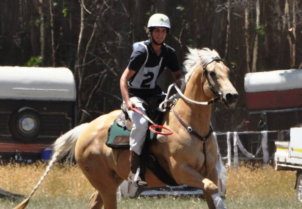 The successful recipient of the Australian Equestrian Scholarship, Asher Trom-Wright playing polocrosse.