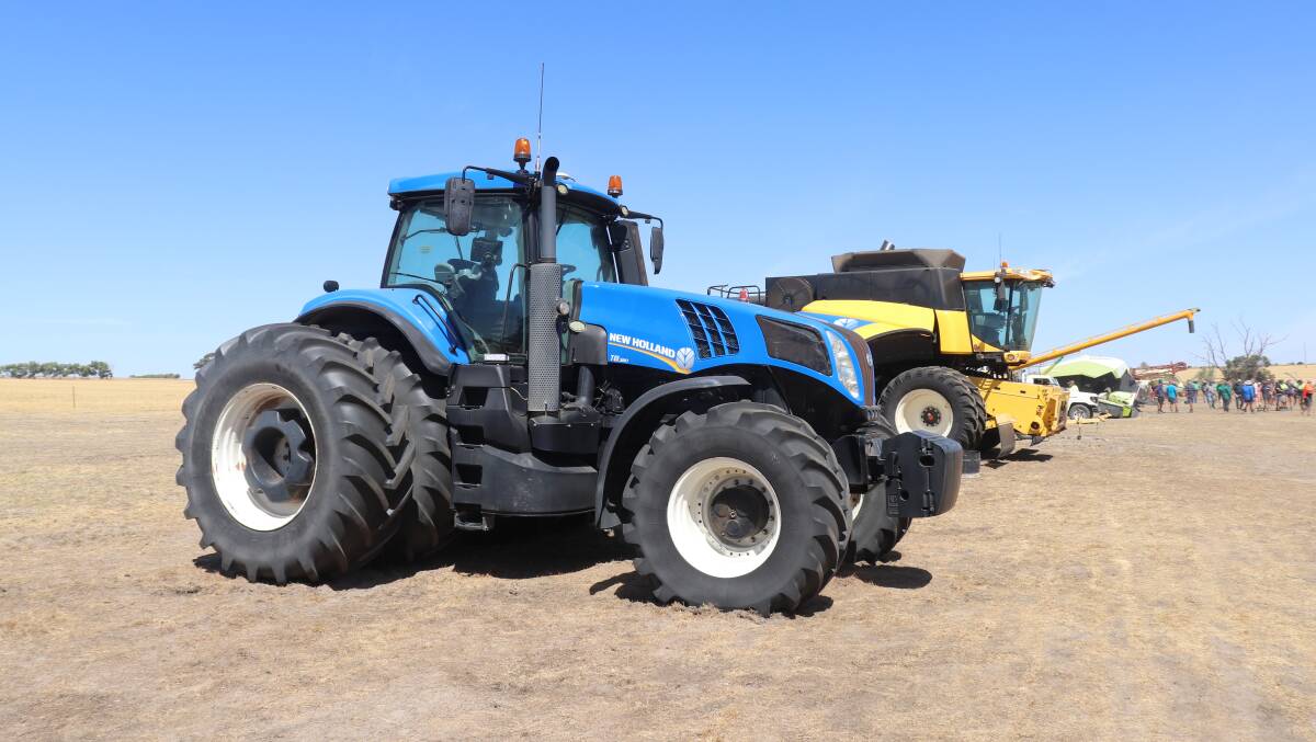 This 2016 New Holland T8.380 front-wheel-assist tractor was the top item, selling for $255,000, while the New Holland CR9060 Elevation harvester behind it sold for $30,000.